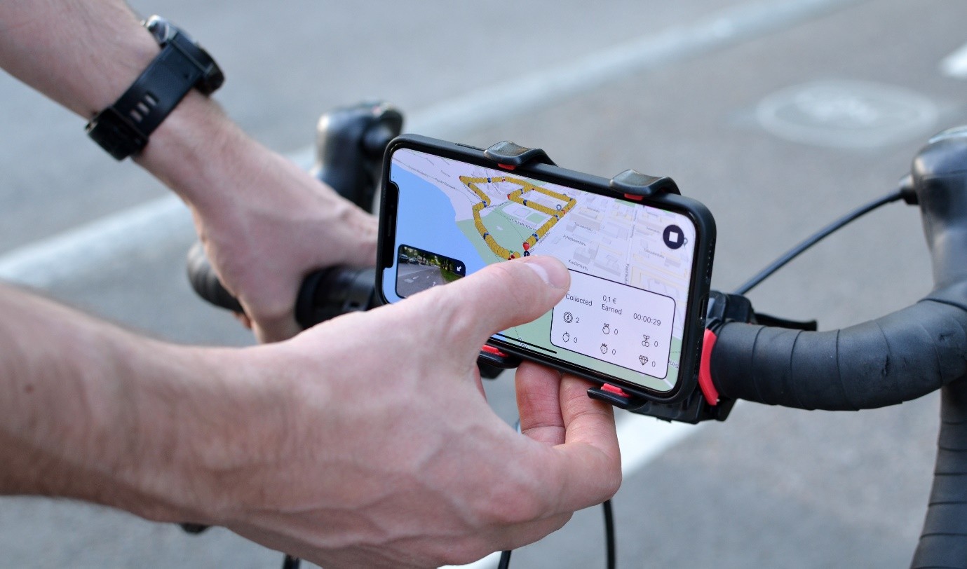The crowd-sourcing app on a bicycle handlebar, recording GPS-tagged video of the path