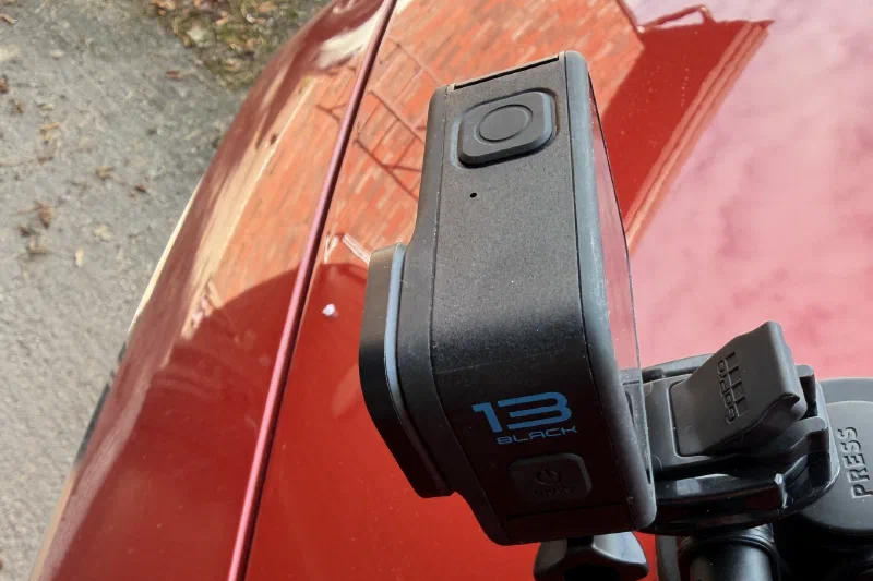 An action camera on a suction mount on a car bonnet, ready to record the pavement video for a SirWay RAMS pilot
